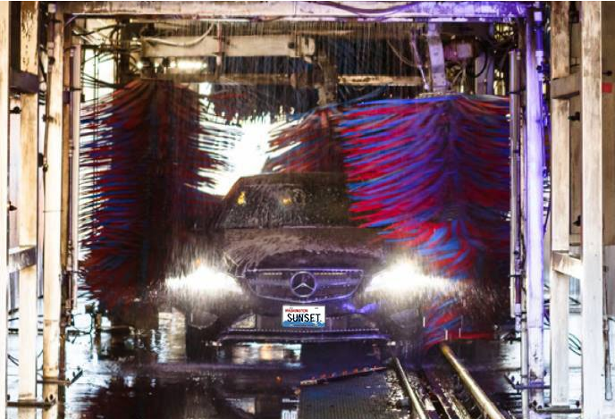 man cleaning car